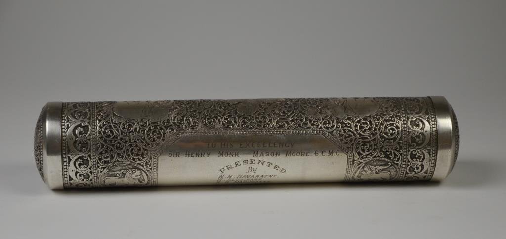 CUTCH INDIAN SILVER SCROLL CASE: Orante foliate scroll decoration mixed with exotic animals including elephants, tigers and griffins, removable end caps. Central Presentation To His Excellency Sir Henry Monk - Mason Moore GCMC, 1946.