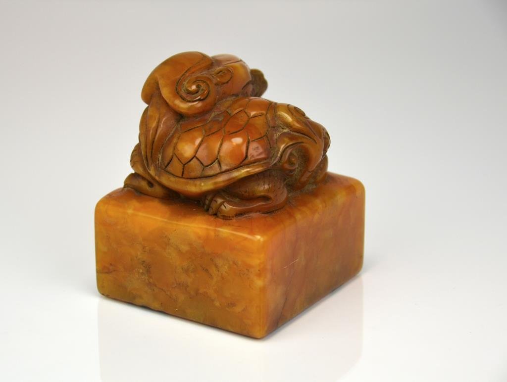 Chinese Carved Orange Soapstone Square Seal: Knob is carved as a dragon turtle, tianhuang style stone. H. 9.5cm (3 3/4 in.) In good condition. Natural stone inclusion, ink marks on seal face, no chip or crack.