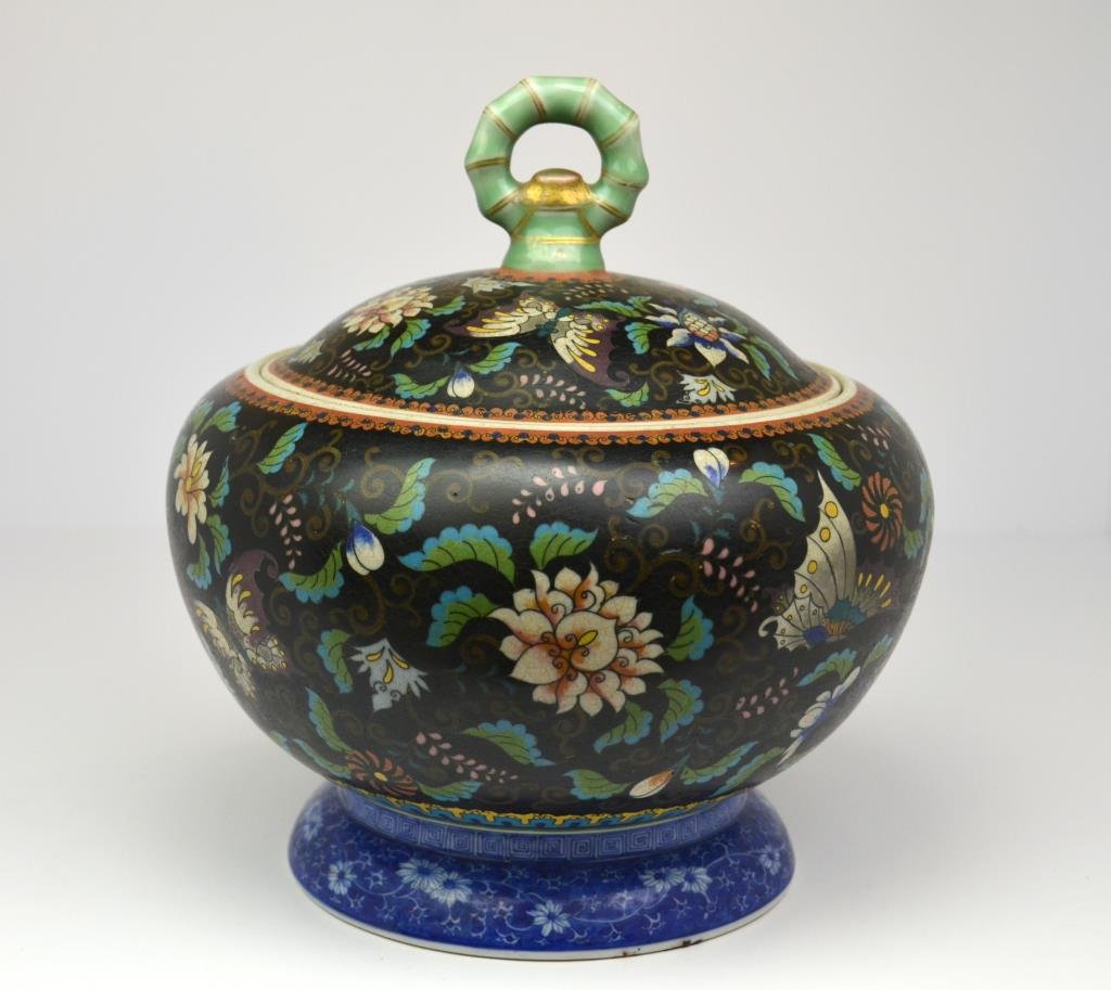 Japanese Totai Cloisonne Covered Jar: Decorated with butterflies on black ground, bamboo finial, Chinese-style scrolling foliage to foot rim. Marked Dai Nippon sei zo, Hirakiyo sha, late 19th century. H. 22.8cm (9 in.) In very good condit