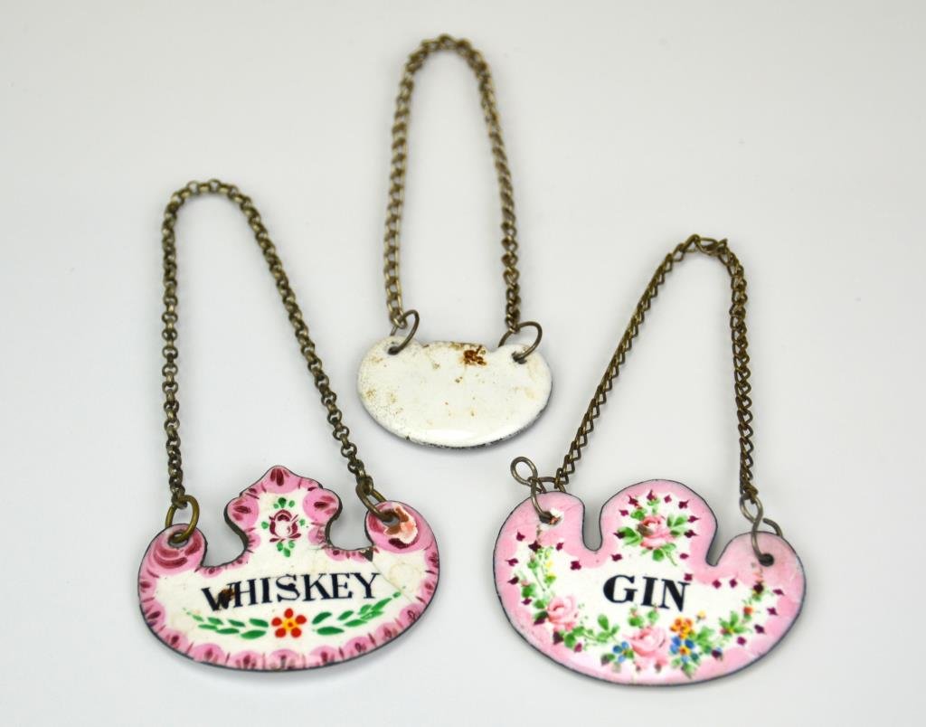 Three Staffordshire Enamel Bottle labels: Whiskey, Gin and blank. Also known as Battersea, 19th cen.