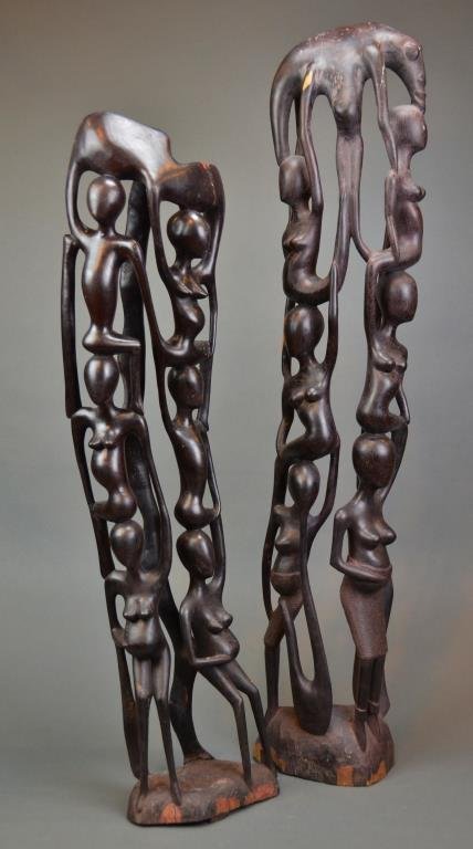 Two Ebony Makonde Tree of Life Carvings: Carved figures in the round. H 31 and 27 inches. Minor splitting.