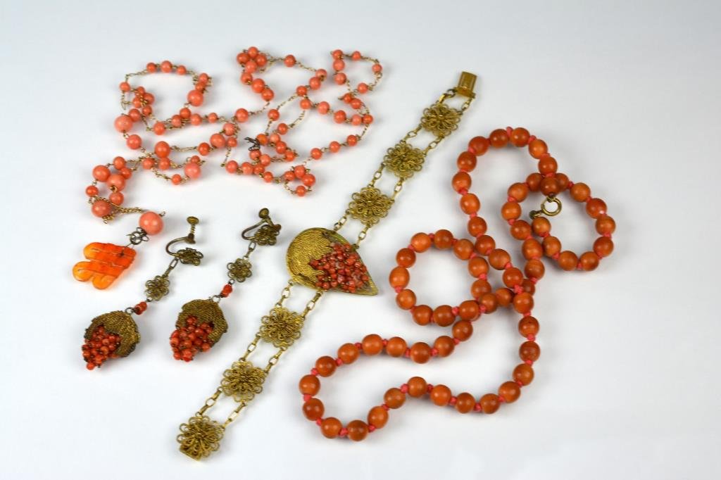 LOT OF ANTIQUE CORAL JEWELLERY: Including a beaded necklace measuring 7mm in diameter, a beaded necklace with gilt wirework and silver-gilt filigree bracelet and earrings with coral clusters.