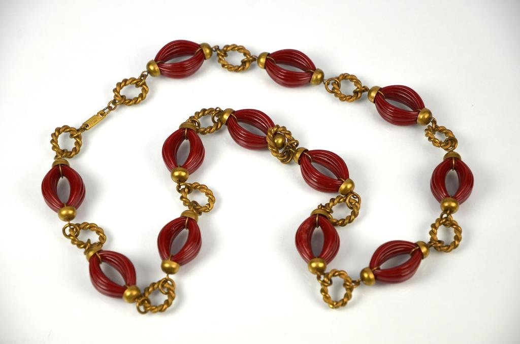 MIRIAM HASKELL NECKLACE: Alternating red glass loops and brass rope loops opera length.