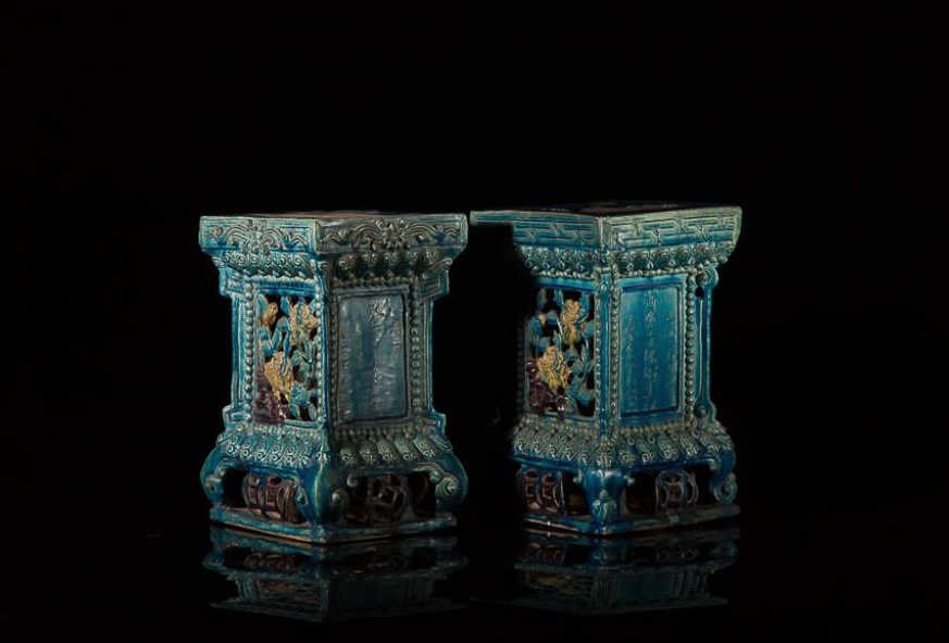 PAIR OF TURQUOISE GLAZED POTTERY STANDS: Carved and pierced with architectural elements and floral windows, inscribed as commissioned by He Huishan on third year of Ming Yongle period (1405) for adorning a pair of fu dogs at the Haihui Templ