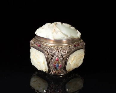 CHINESE SILVER & CARVED JADE BOX: Double walled triangular box, each corner set with semi-precious stones including spinal ruby and sapphire. Three light celadon Ming jade plaques are set into the base of the box, and a 18th century j