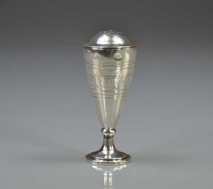 AUSTRIAN SILVER CASTER: Vienna, 1806. The flared body engraved with bands of decoration rising from a cast foot with a domed and pierced lid. Maker indistinct, marked with standard mark and various tax marks 86 gm. Height 9.