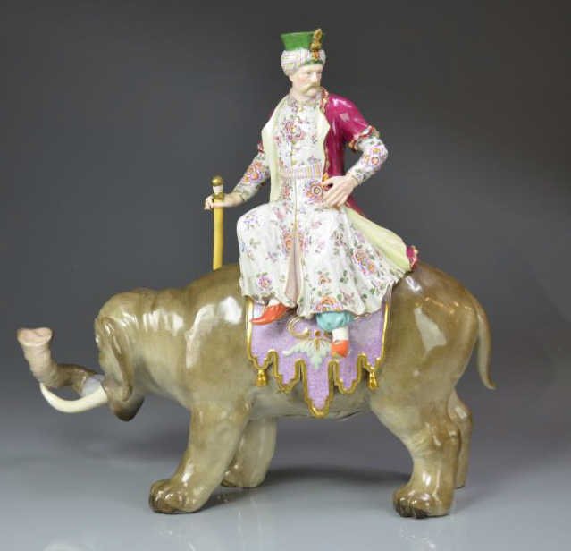 MEISSEN PORCELAN SULTAN ON ELEPHANT FIGURE: Hand painted cloaked figure riding a large elephant, crossed swords mark on underside of elephant, 19th c. W. 46 cm (18 in.) some restoration