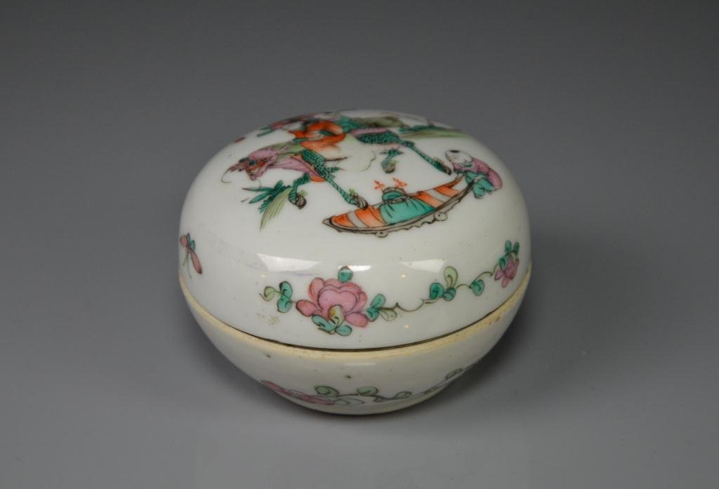 FAMILLE ROSE PORCELAIN COVERED PASTE BOX: Hand painted with boys riding on a qilin. Base is marked "Wan Songmao zuo" (Made by Wan Songmao), Republican period. Dia. 8.1cm (3 1/4 in.)