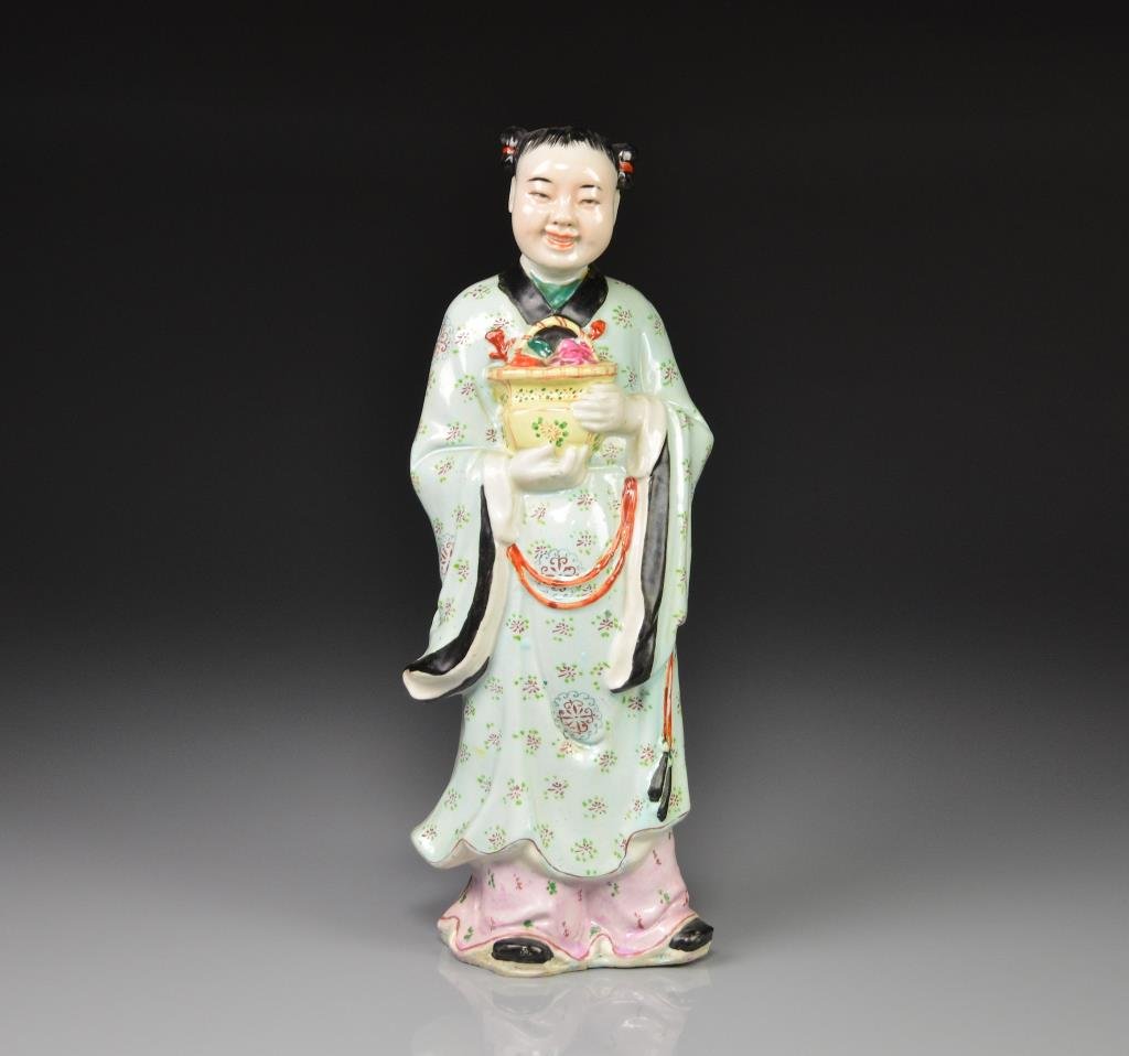 REPUBLICAN FAMILLE ROSE PORCELAIN FIGURE: Daoist Immortal Han Xian Zi holding flower basket. Da Ming Tao Chi Chang Made In China mark. H. 34cm (13 1/2 in.)