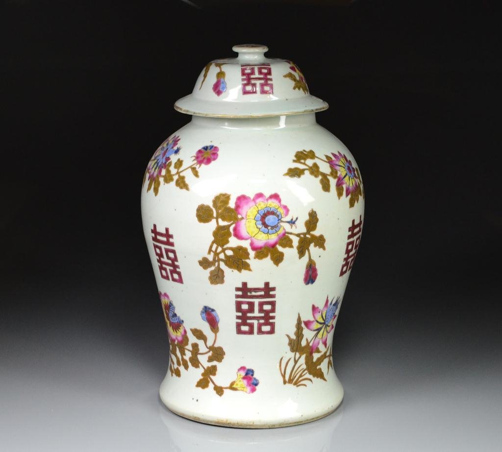 CHINESE FAMILLE ROSE PORCELAIN COVERED URN: Enamel painted with puce Shou double happiness symbols and floral sprays, jingdezhen mark to base, 19th C. H 43 cm. (17 in.)