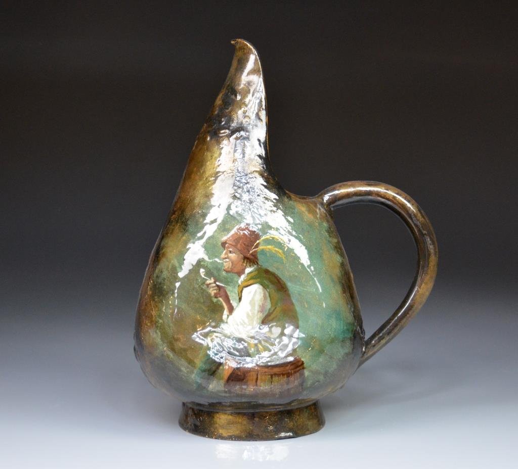 EMILE GALLE ART NOUVEAU POTTERY EWER: Luster brown body with a man smoking a pipe, base signed E. Galle Nancy 238 with original paper label. H 28.5 cm. (11 1/4 in.)