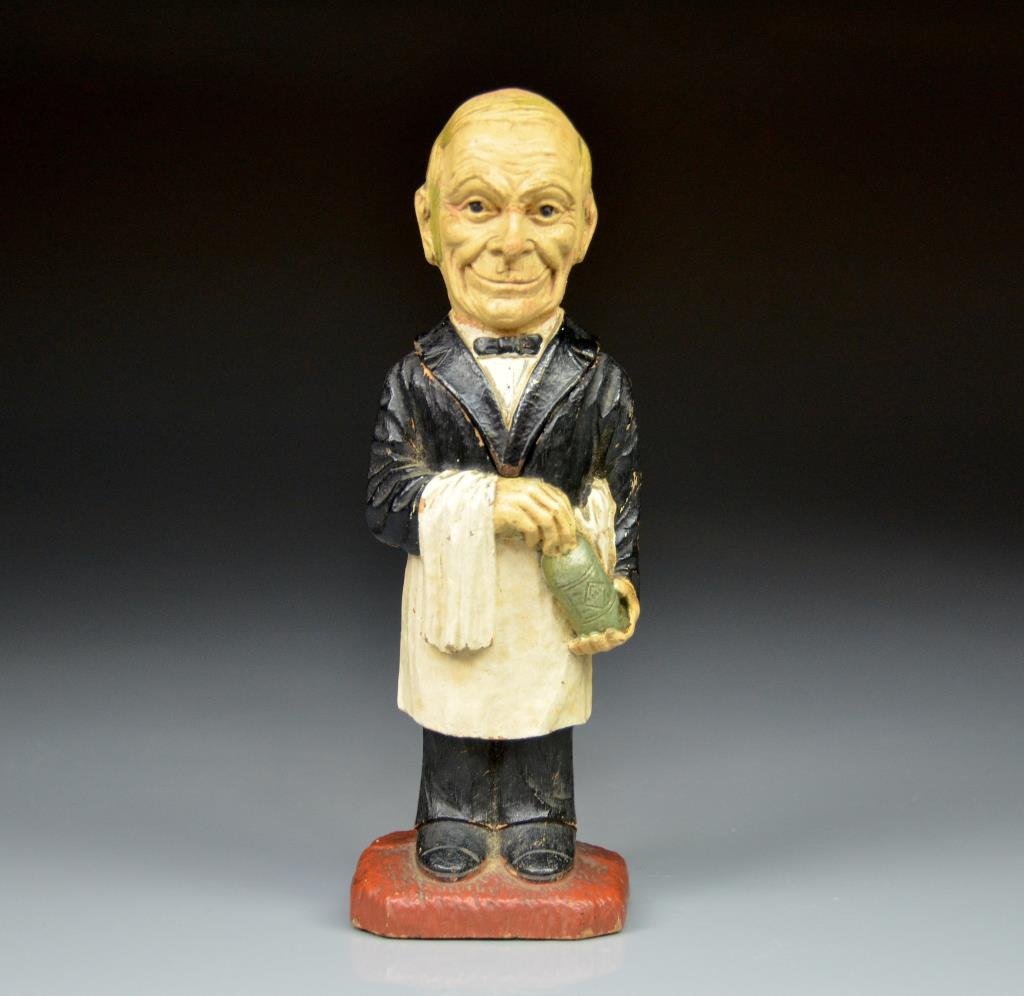 FOLK ART CARVED WOOD FIGURAL CORK SCREW: Of a polychrome painted butler, head detaches to reveal with metal corkscrew. H 20 cm. (8 in.)
