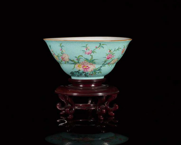 FAMILLE ROSE TURQUOISE GROUND PORCELAIN OGEE BOWL: Finely enameled and painted with blossoming chrysanthemums on a turquoise ground incised with scrolling foliage. Six-character Qianlong mark, Jiaqing period. Dia. 20.5cm (8 1/8 in.)