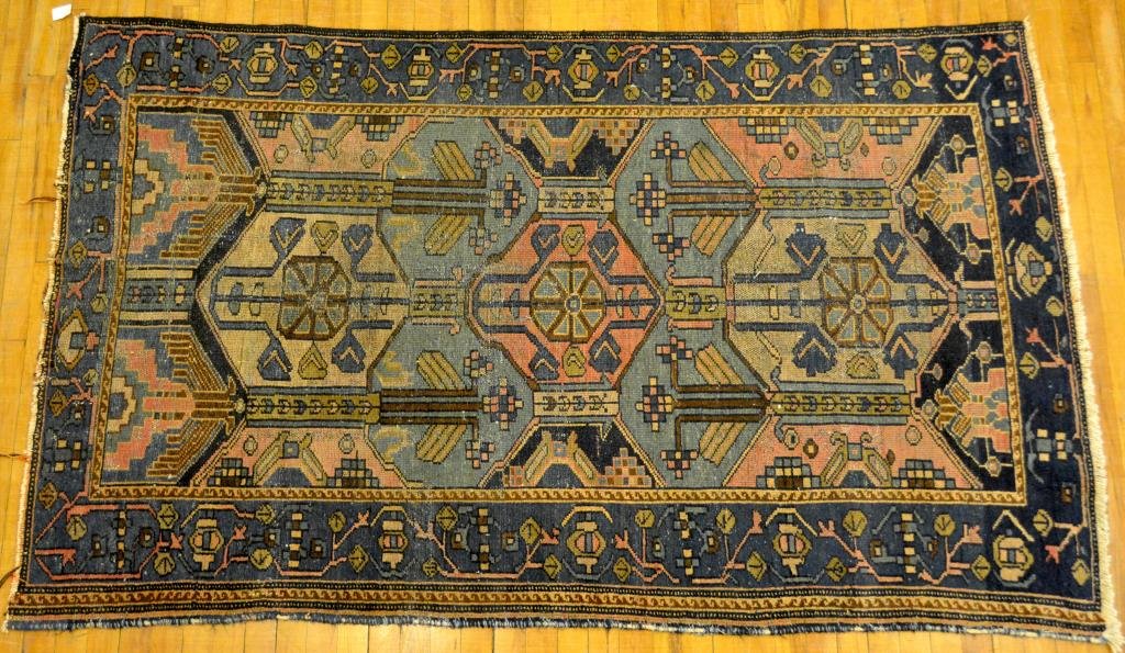 SEMI ANTIQUE CAUSCASIAN PRAYER RUG: Navy and blue ground with light green and pink geometric patterns, 4 ft x 6ft 8'