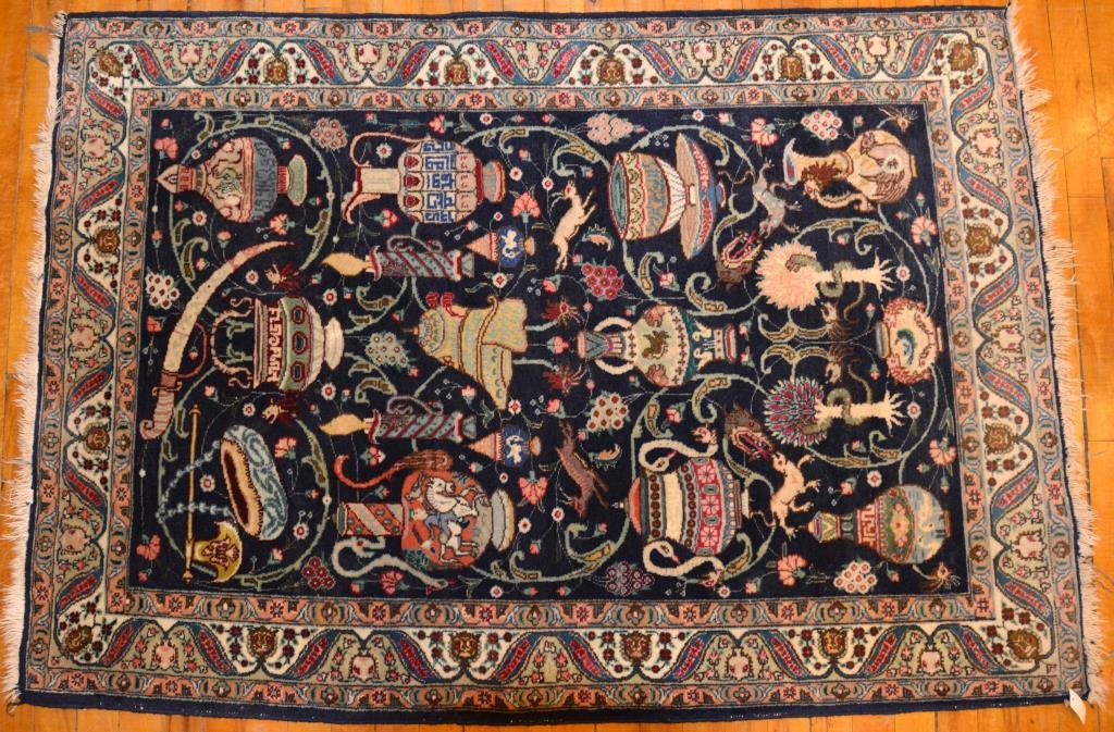 NAVY GROUND PERSIAN PICTORIAL RUG: Hand knotted depicting Ottoman and Persian antique vases, swords & jugs surrounded by a saz leaf border. 38 in x 55 in.
