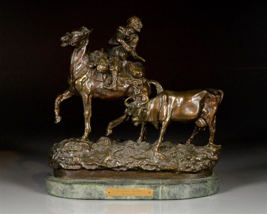 BRONZE SCULPTURE AFTER VASILII GRACHEV: "Ukranian Rustler", after the model by Vasilii Grachev, labeled Grechov, cast by Woerffel. Man on horseback with steer, on green stone base. H: 32cm (12 1/2 in.) W: 30cm (12 in.)