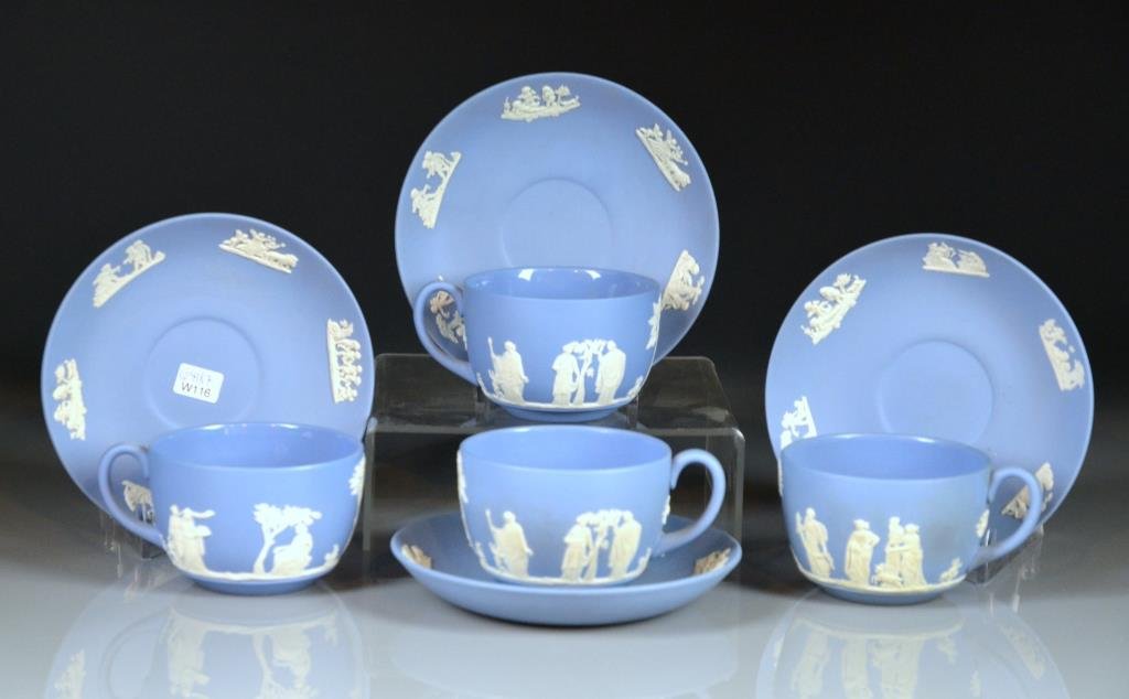 FOUR WEDGWOOD BLUE JASPERWARE TEA CUPS & SAUCERS: With classical motifs, 20th C. D. of saucer 14 cm (5 1/2 in.)