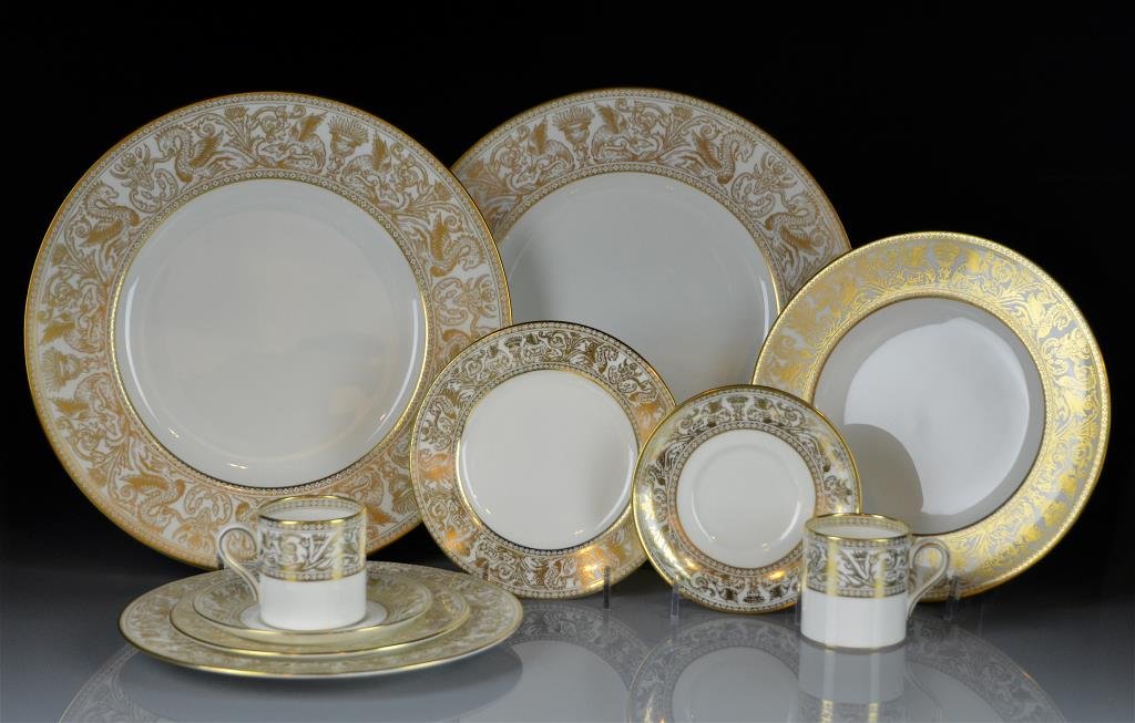 WEDGWOOD PORCELAIN DINNER SERVICE: Gold Florentine W4219 Including 12 dinner plates, 12 salad plates, 12 bread & butter plates and 12 coffee cups and saucers.