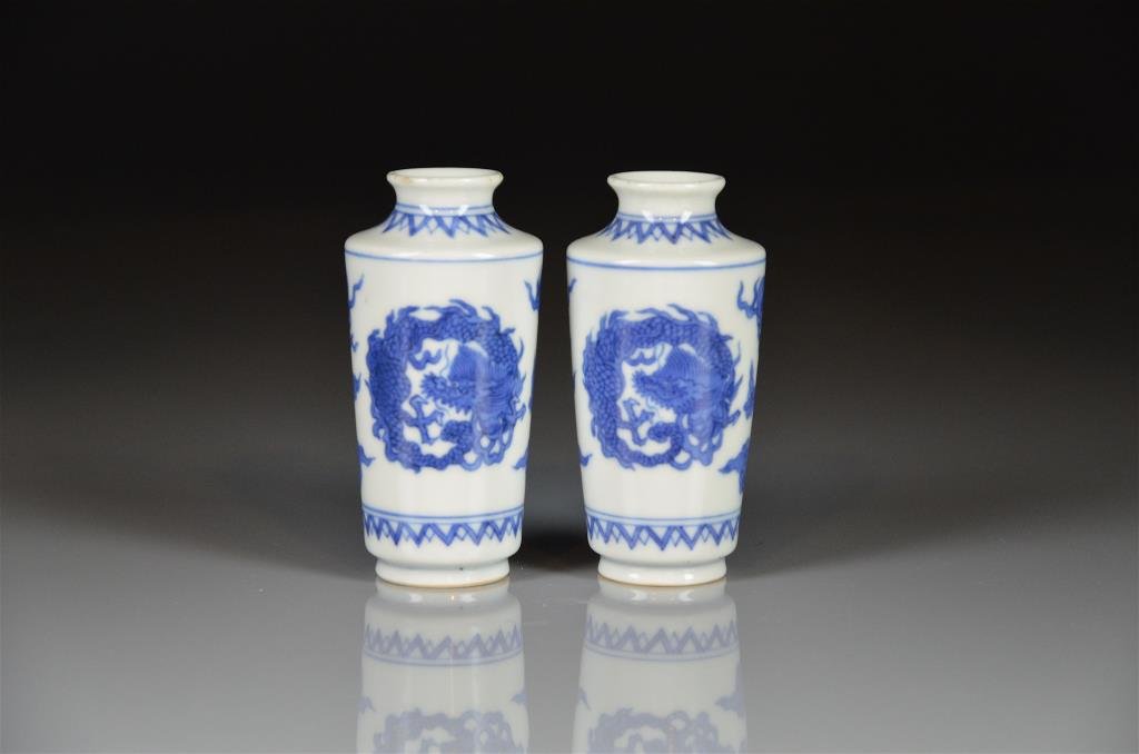 PAIR OF JAPANESE MINIATURE PORCELAIN VASES: Blue and white with dragons, clouds and fire balls, underside marked Seifu Yohei. H 8.5 cm. (3 1/4 in.)