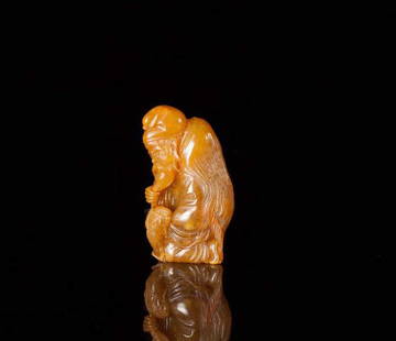 FINELY CARVED TIANHUANG SEAL: Orange peel yellow tianhuang, carved of an elderly man stroking his beard with a ram seated next to him, signed, attributed to Shi Qing 石卿 (Guo Mao Jie 郭懋介). H 4