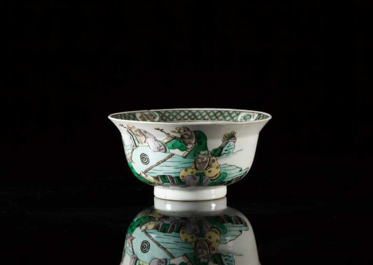 FAMILLE VERTE PORCELAIN BOWL: The exterior of the bowl is painted with five scholar seated around a table. The interior painted with an immortal and deer, Kangxi period. Dia 14 cm (5 1/2 in.)