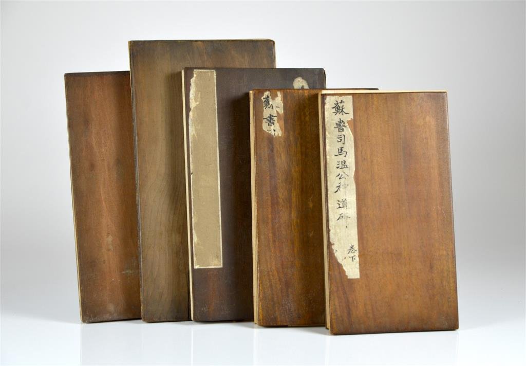 FIVE STONE RUBBING ALBUMS OF SONG DYNASTY STELES: All accordion album with wood boards. First two volumes as a set of a Northern Song stele written by Su Shi (1037-1101), with 75 and 68 pages of rubbing respectively. The third volume with 34 pages of