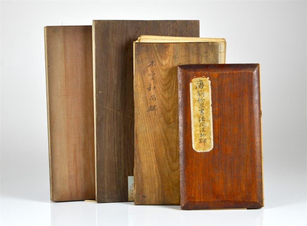 FOUR STONE RUBBING ALBUMS OF TANG DYNASTY STELES: Buddhist themed steles. All accordion album with wood boards. The first Yu Quan Shi stele with 42 pages of rubbing. The second stele with 30 pages of rubbing. The third stele with 62 pages of rubbing.