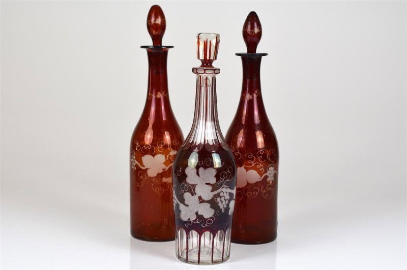 THREE BOHEMIAN RED FLASHED GLASS DECANTERS (1 of 1)