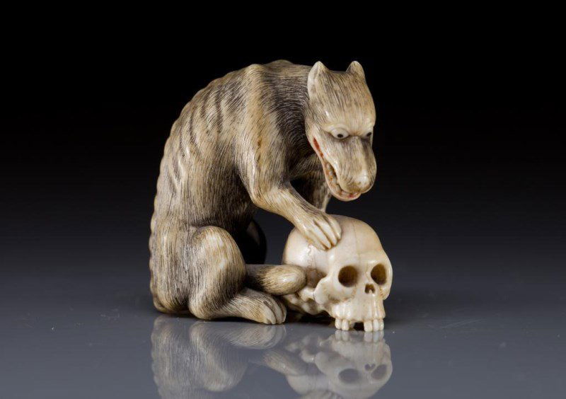 MEIJI IVORY NETSUKE OF WOLF AND SKULL (1 of 1)