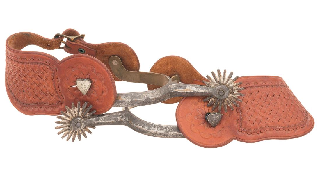 Two Pairs of August Buermann Spurs with Leather Straps: Two Pairs of Desirable August Buermann Spurs with Leather Straps 1) August Buermann ladies style spurs marked "star AB" and "STAR STEEL SILVER, lightly engraved heel bands, straight shanks, clover row