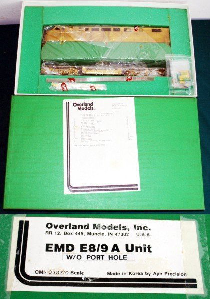 EMD E-8/9 A Overland Ajin Brass O UP: EMD E-8/9 A without side port holes Overland Ajin Brass O Unpainted (OMI 0337). The unit is powered with can motors and tank drives. The model is for 2 rail DC operation. The unit has a detail package