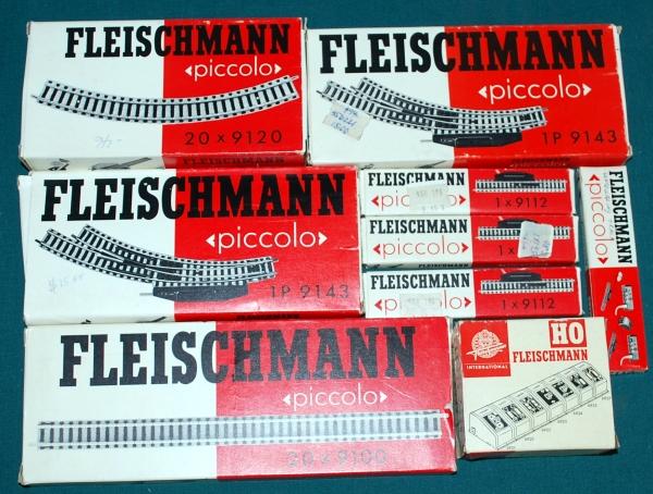 Fleischmann Track in boxes N Scale: Fleischmann Track in boxes N Scale. The track appears to be in the original boxes and packing. We see in the boxes 17 pc. of Straight Track (9100), 6 pc. Curved Track (9120), 2 pc. Curved Switches (91