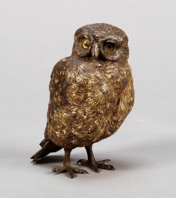 A Viennese cold-painted bronze owl: A Viennese cold painted bronze model of an owl, early 20th century, stamped 'GESCH, 6250' and with faint stamp 'B' within a vase for Franz Bergmann to the underside, 13.5cm high (lacking one glass eye