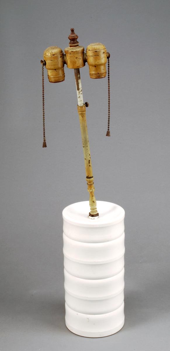 Keith Murray for Wedgwood, a ribbed cylindrical'Mo: Signed: Keith Murray for Wedgwood, a ribbed cylindrical'Moonstone' glazed table lamp, with a paintedmetal twin bulb fitm