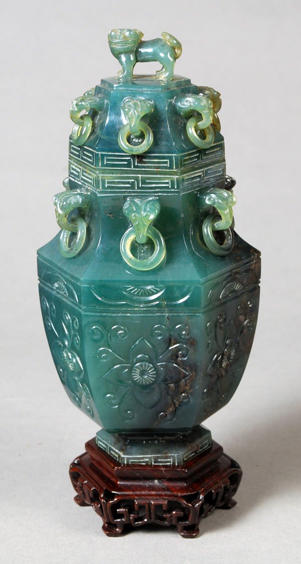 A Chinese turquoise-green chalcedony hexagonalbalu: A Chinese turquoise-green chalcedony hexagonalbaluster vase, the neck with ring handles, abovea band of flowerheads and scrolls, th