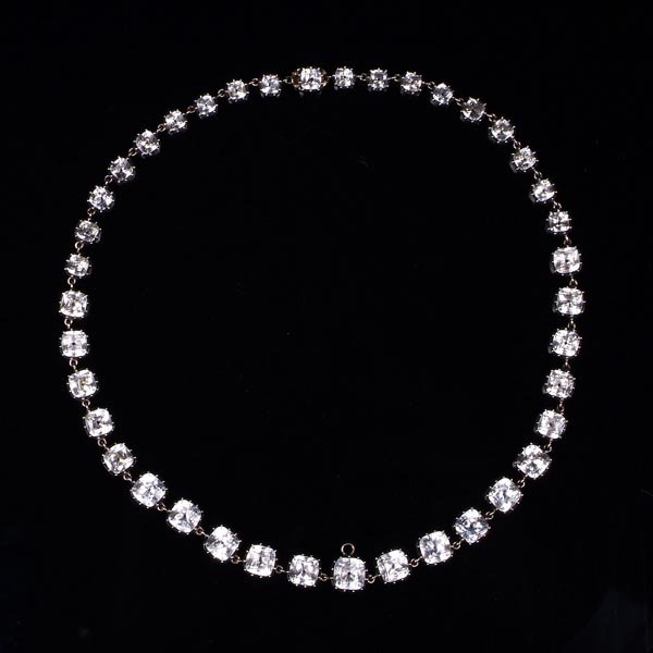 A Georgian paste rivi?re, circa 1800, the graduate: A Georgian paste rivi?re, circa 1800, the graduated cushion shaped colourless pastes in flat, foiled closed back gold backed silver