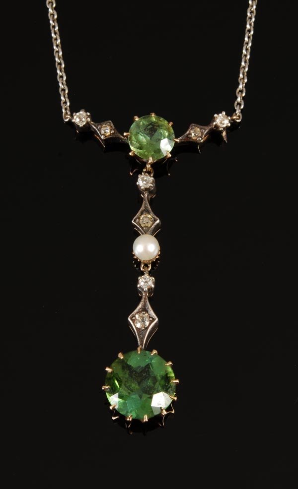 An Edwardian green tourmaline, pearl and diamond n: An Edwardian green tourmaline, pearl and diamond necklace, circa 1910, the circular-cut green tourmaline claw set drop with diamond