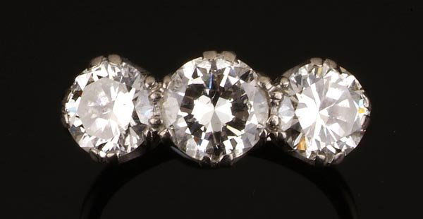 A diamond three stone ring, the old brilliant-cut: A diamond three stone ring, the old brilliant-cut diamonds, approximately 2.75 carats total, claws set in individual coronet mounts