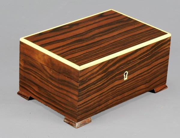 A rosewood and faux ivory banded humidor by Dunhi: A rosewood and faux ivory banded humidor by Dunhill and Co., late 20th century, of rectangular form with bracket feet, the hinged lid opening with guages for temperature and humidity, 12cm hi