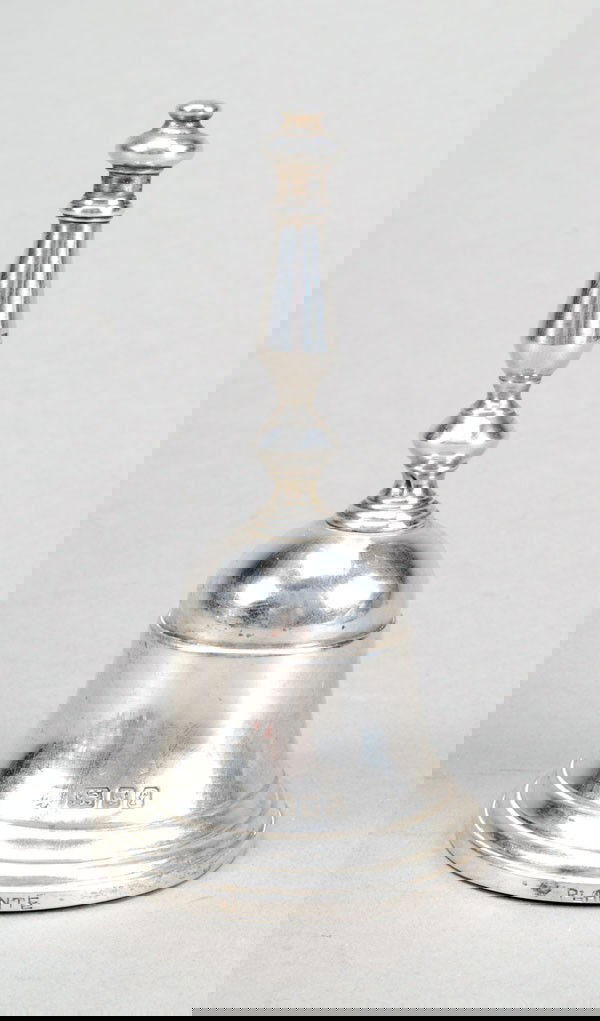 A silver table bell by Richard Comyns, London 1961: A silver table bell by Richard Comyns, London 1961, retailed by Plante, with a baluster handle and a moulded base, 11cm (4.25in) high, 190g (6.1 oz). Provenance: Cornwallis