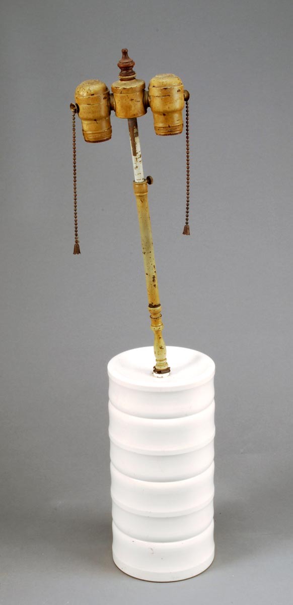 Keith Murray for Wedgwood, a ribbed cylindrical 'M: Keith Murray for Wedgwood, a ribbed cylindrical 'Moonstone' glazed table lamp, with a painted metal twin bulb fitment, the base shape 3955, printed facsimile signature mark, impressed mark, 2