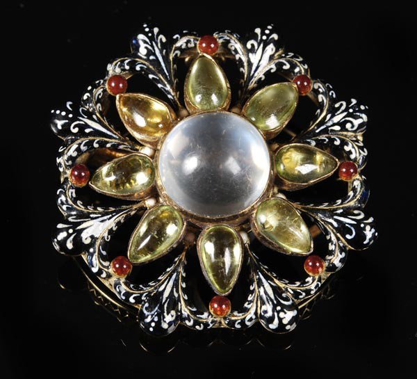 A Victorian gold and gem set Renaissance Revival b: A Victorian gold and gem set Renaissance Revival brooch by Carlo Giuliano, circa 1875, designed by Pasquale Novissimo, the central moonstone cabochon rub over set above peridot cabochon 'leav