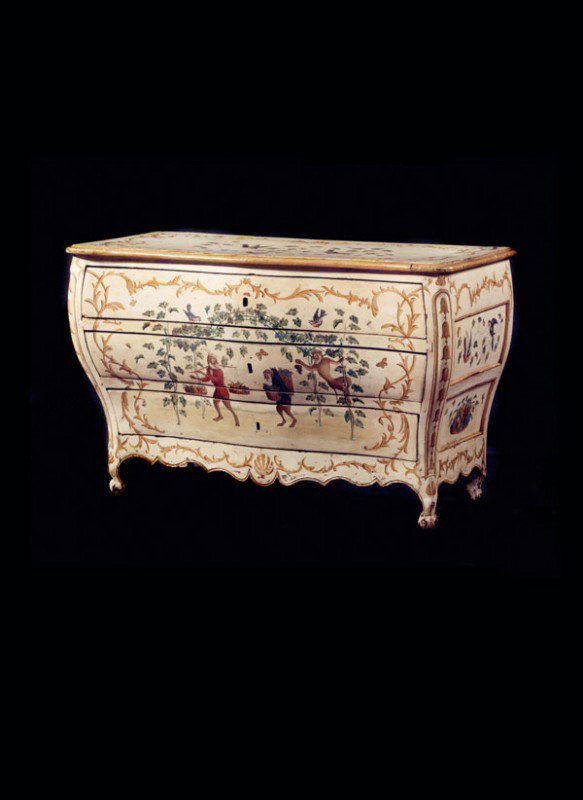 An Italian painted bombe commode, in late 18th cen: An Italian painted bombe commode, in late 18th century Lombardy style, the serpentine moulded top above three drawers and a shaped moulded apron, the front painted with gilt scrolls and monke