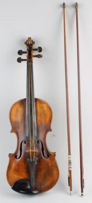 A violin, the two-piece back 36cm long, hand-writt: A violin, the two-piece back 36cm long, hand-written within 'Piotti Montebello' and similarly stamped below the button, cased; together with two bows, both unnamed.