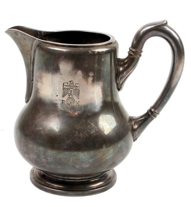 Adolf Hitler (Reichskanzlei) - A Third Reich Silve: Adolf Hitler (Reichskanzlei) - A Third Reich Silver Formal Pattern Table Jug by Wellner, bearing the eagle device with wings folded and displayed, flanked by the initials R.K.16cm high
