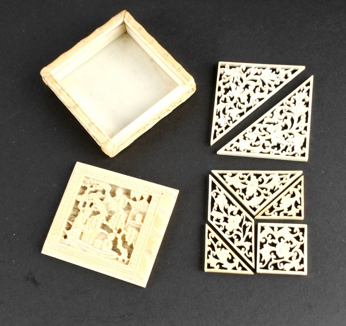 A Chinese pierced and carved ivory tangram puzzle: A Chinese pierced and carved ivory tangram puzzle, 19th century, 5.8cm square