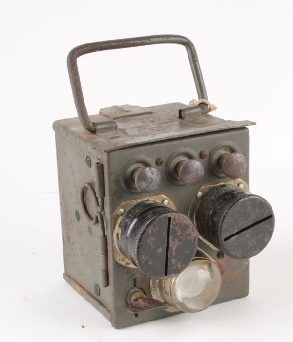 A Second World War German Heer Respirator, of stan: A Second World War German Heer Respirator, of standard production specification, the mask, bearing Waffen marks, dated 1939, complete in its original container, retaining much of its field-green paint