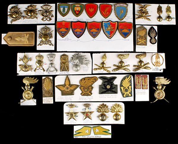 A Collection of Second World War Italian Army Meta: A Collection of Second World War Italian Army Metal and Cloth Insignia, including a rare brass turban badge for the Ethiopian native Carabinieri Reali for mounted troops (Harrar) district, etc,