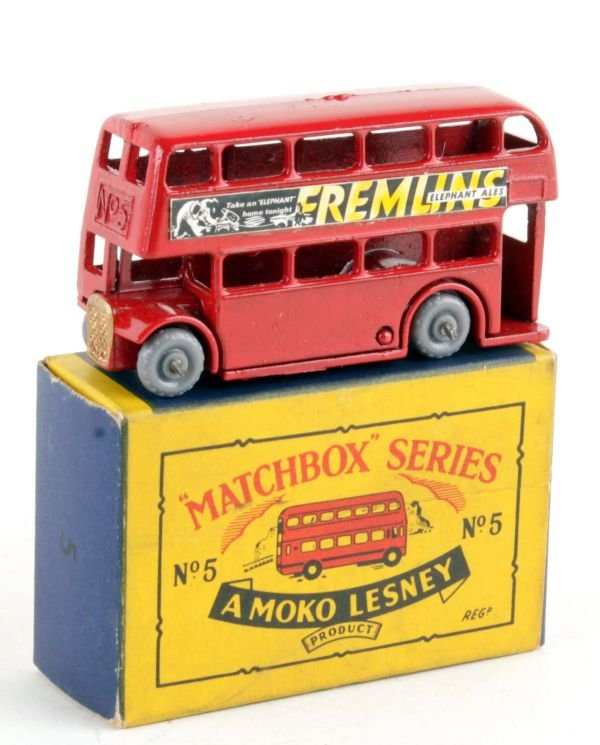 A rare Matchbox 1-75 series No.5, London Bus, with: A rare Matchbox 1-75 series No.5, London Bus, with 'Fremlins' adverts, red with a copper-coloured radiator, grey plastic wheels, mint, boxed, the box good.Note: This model has unrecorded but professio