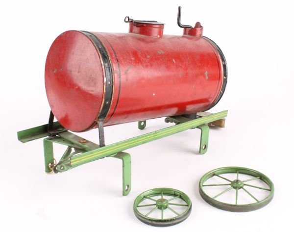 A tinplate street water carrier, possibly by Bing